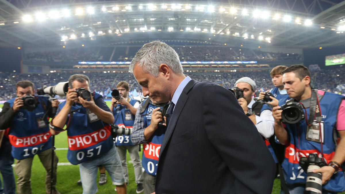Photographers swarm Jose Mourinho on the sidelines during the Champions League match. 