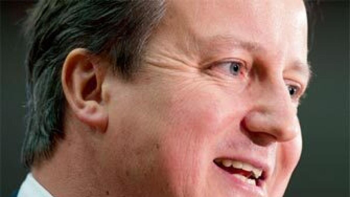 Cameron urges migrant curbs, warns on British EU exit