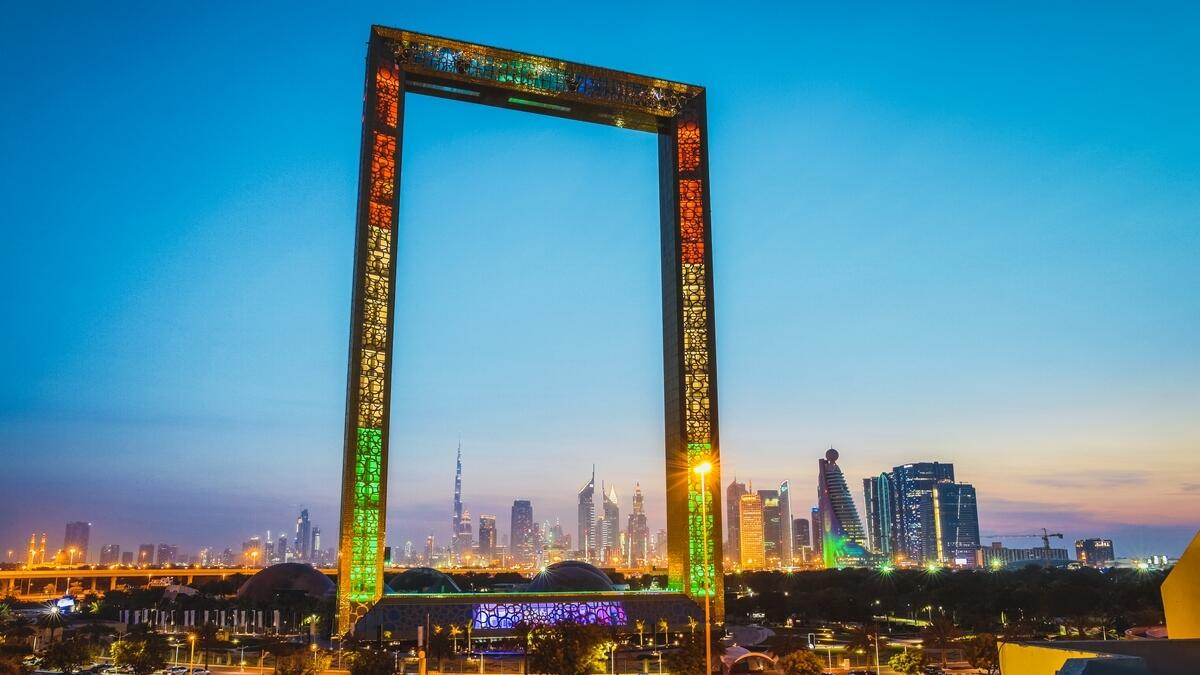 The Dubai Frame with the Dubai skyline in the background. Among the non-oil sectors, travel and tourism, real estate, aviation and trade have seen exponential growth. — File photo