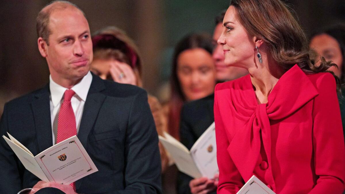 Britain's Prince William, Duke of Cambridge (L) and Britain's Catherine, Duchess of Cambridge take part in 'Royal Carols - Together At Christmas', a Christmas carol concert hosted by the Duchess at Westminster Abbey in London on December 8, 2021. Photo: AFP