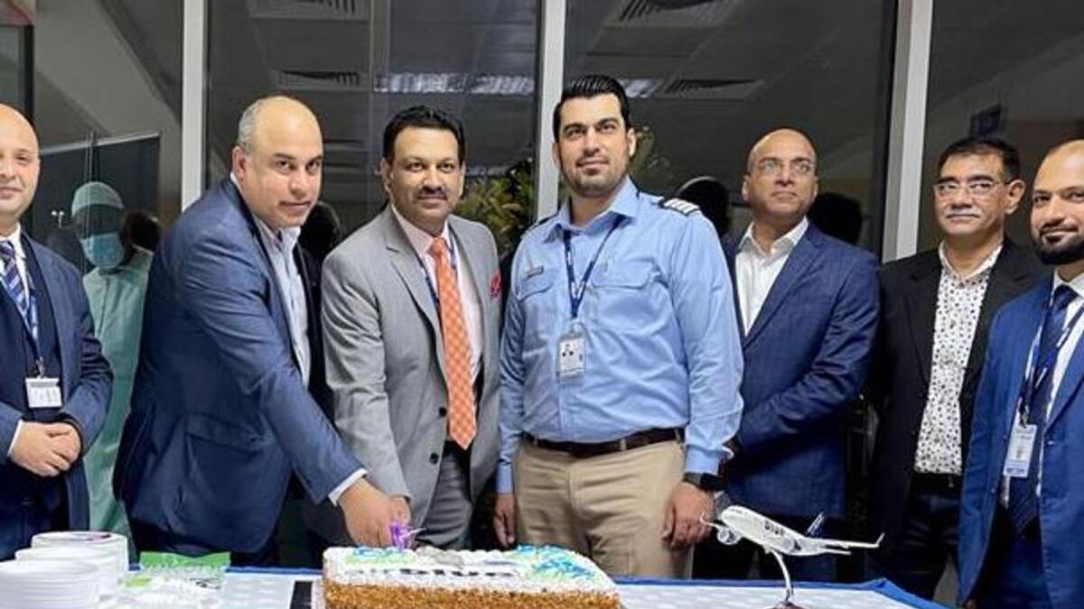 Caption: Amer Alazaiza, head of Commercial Department at Ras Al Khaimah Airport, Sohail Sheikh, airblue's country manager for the UAE, Chandrashekhar Deshmukh, and other senior officials at the cake-cutting ceremony  to mark the inaugural flight from Lahore at Ras Al Khaimah Airport. -- Supplied photos