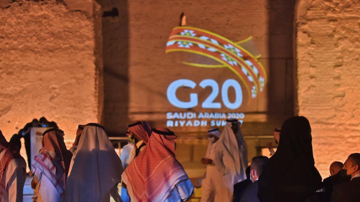The G20 logo is projected at the historic site of Al Tarif in Diriyah district, on the outskirts of Saudi capital Riyadh, on November 20, 2020. AFP