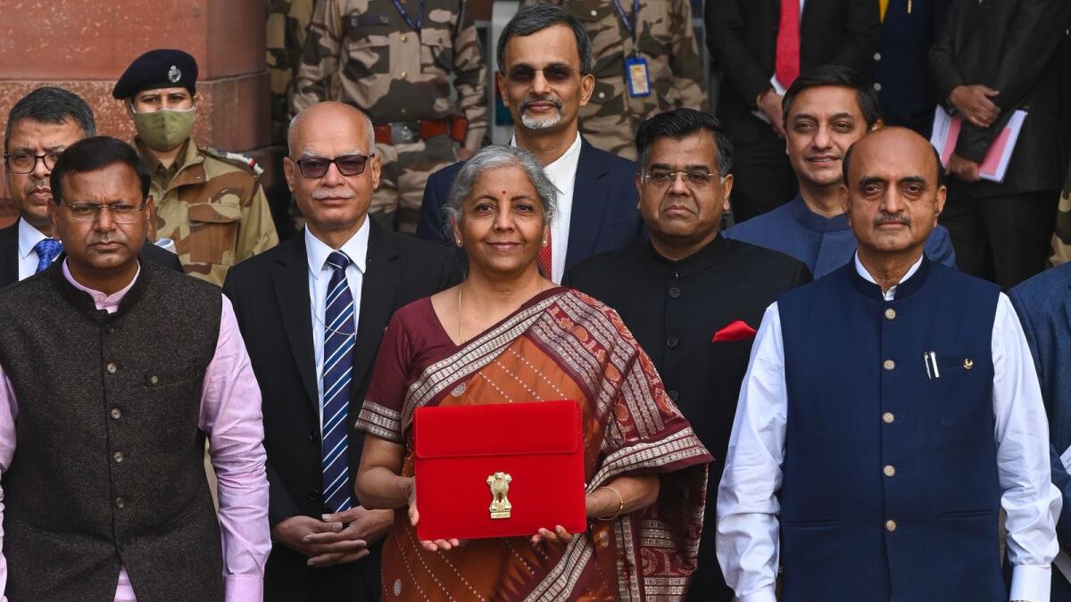 India's Finance Minister Nirmala Sitharaman (C) along with the ministers of state for finance Pankaj Chaudhary (L) and Bhagwat Kishanrao Karad (R) leaves the ministry of finance to present the annual budget at the parliament in New Delhi on February 1, 2022. (Photo: AFP)
