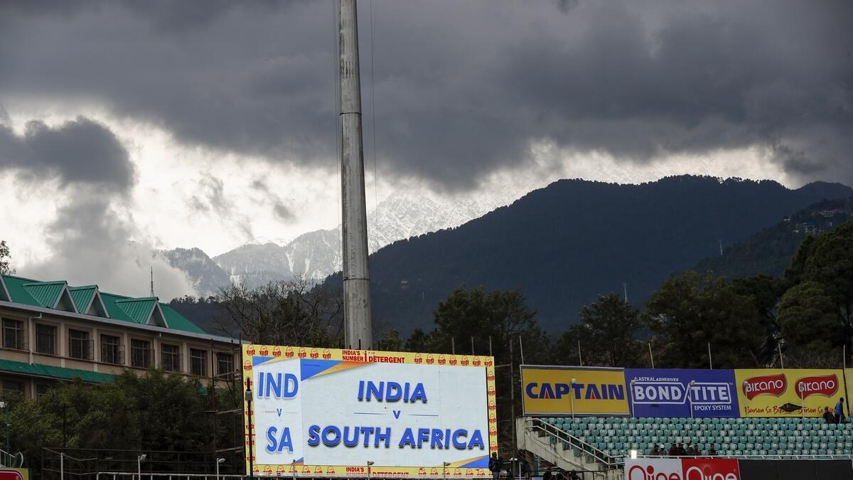 Dark clouds loom over the Himachal Pradesh Cricket Association stadium on Thursday (AP)