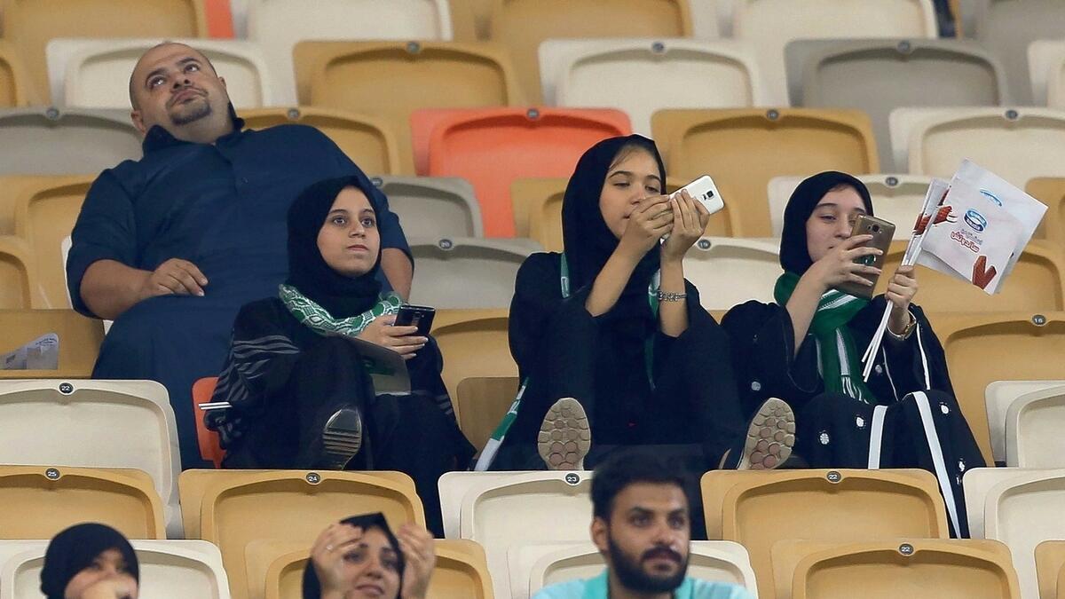Female supporters of Al Ahli attend their teams football match against Al Batin at the King Abdullah Sports City in Jeddah. — AFP