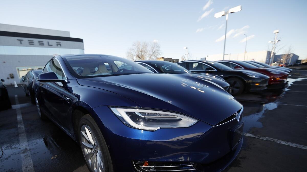 Tesla extends profit run, promises record production, driving stock up 13%