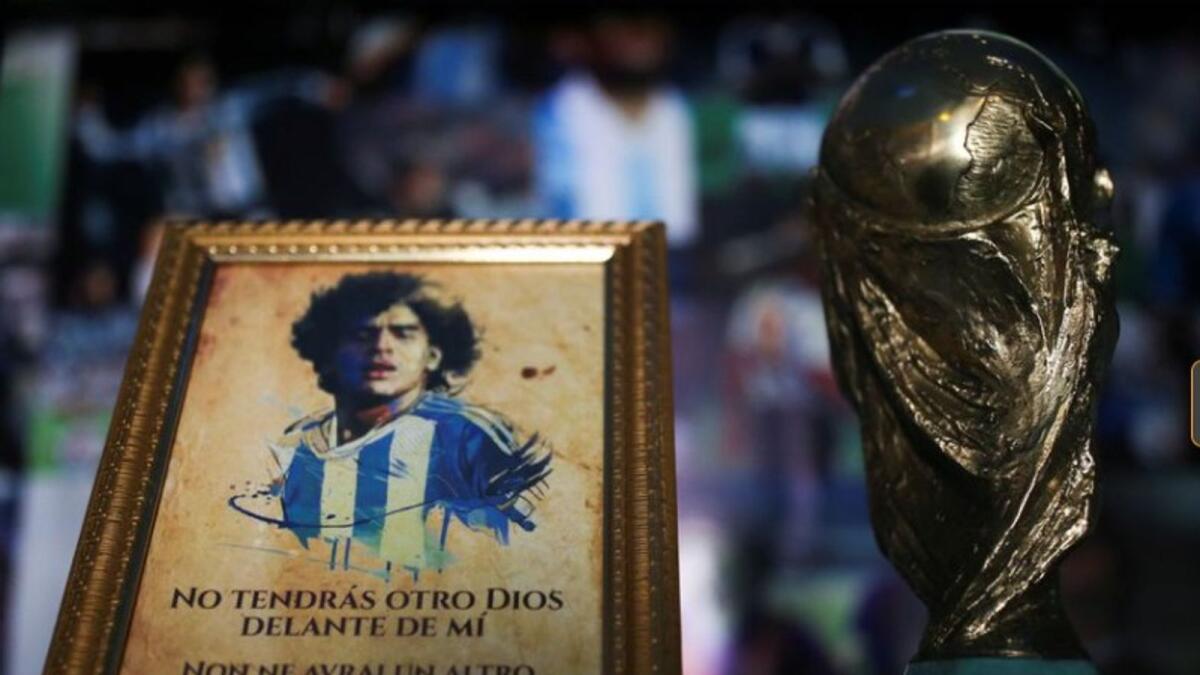 A picture of Diego Maradona and a replica of the World Cup trophy seen at Mexican church built in memory of the football legend. (Reuters)