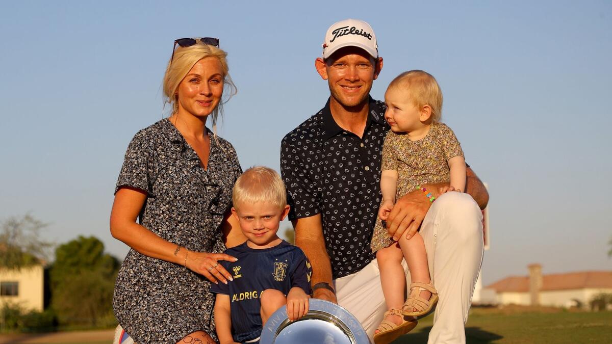 Joachim Hansen and his family pose with the trophy after winning the Aviv Dubai Championship at the Fire Course of the Jumeirah Golf Estates in Dubai on Sunday. — Supplied photo
