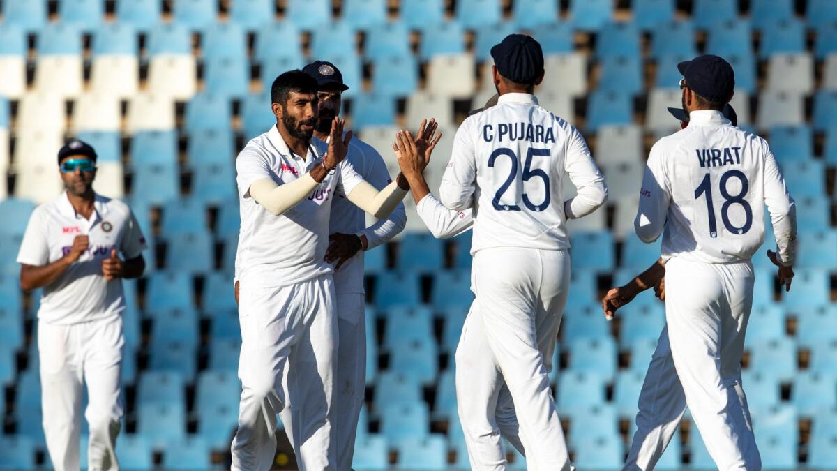 India's Jasprit Bumrah (left) celebrates with teammates after taking the wicket of South Africa's Rassie van der Dussen. (AP)