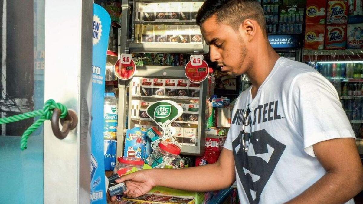 How easy is it for kids to buy cigarettes in UAE?