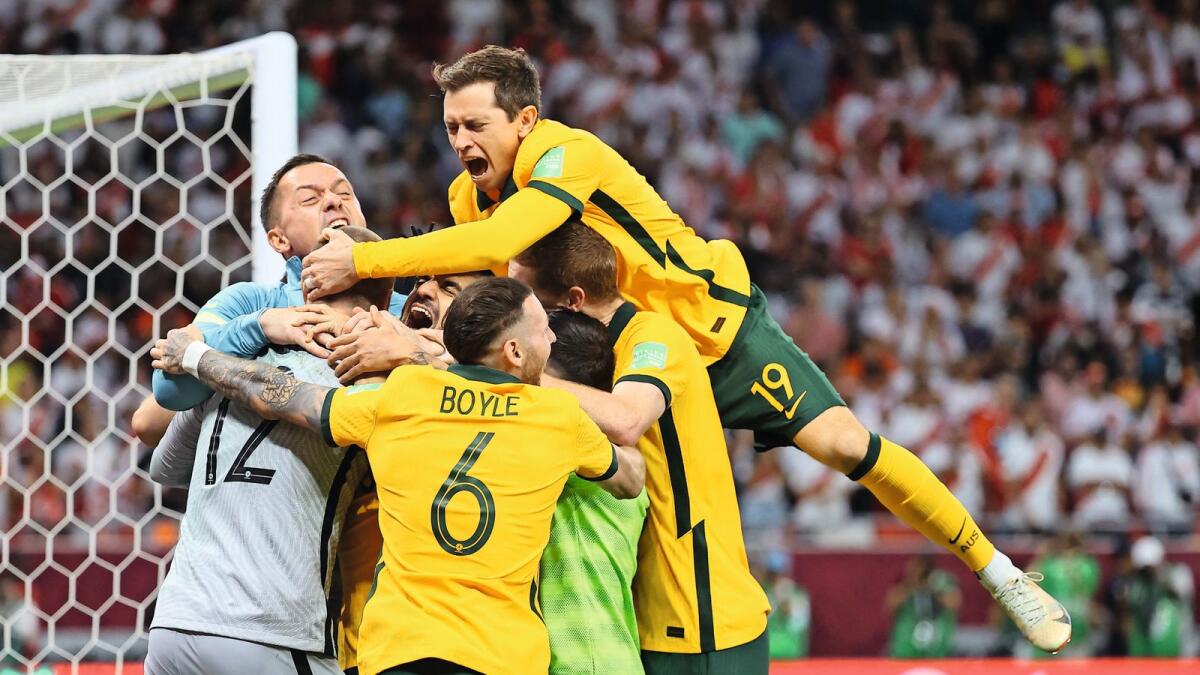 Australian players celebrate after winning the FIFA World Cup 2022 inter-confederation playoff against Peru. — AFP