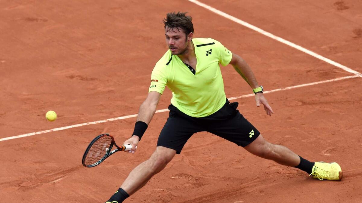Stanislas Wawrinka returns the ball to Czech Republics Lukas Rosol during their mens first round match at the Roland Garros 2016 French Tennis Open on Monday.