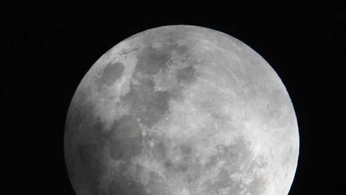 A faint shadow from the Earth is cast over part of the Moon during a penumbral lunar eclipse.
