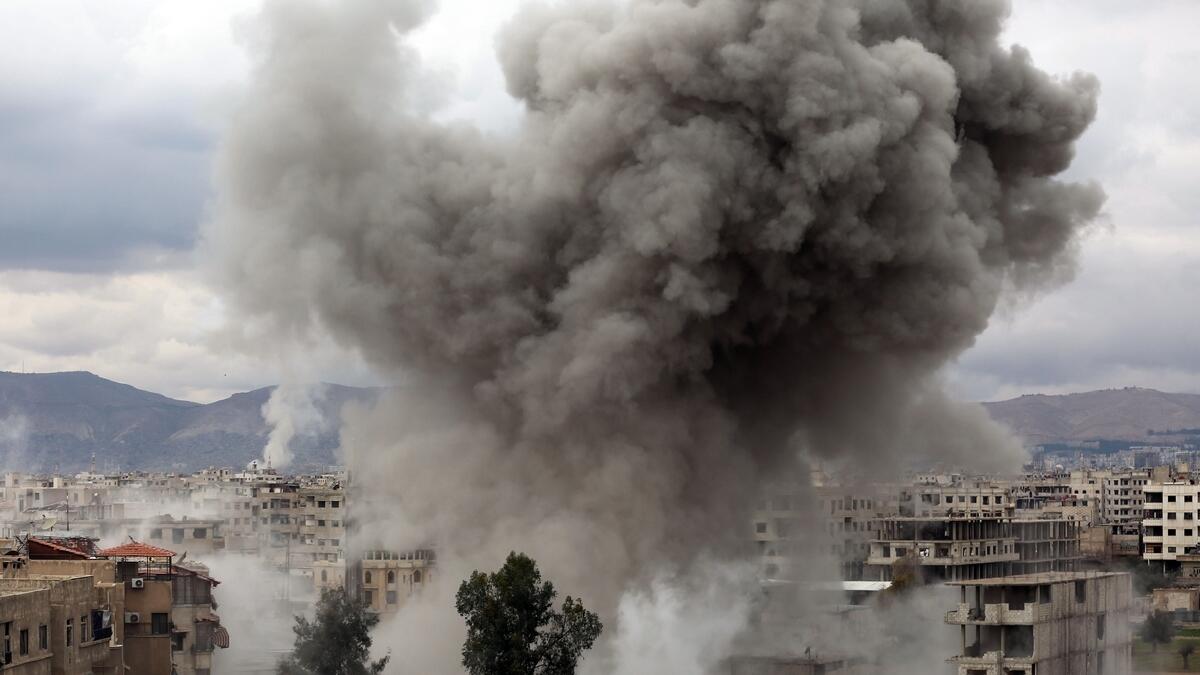 Smoke billows following Syrian government bombardments on Kafr Batna, in the besieged Eastern Ghouta region.- AFP