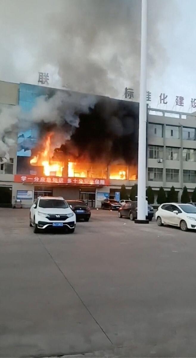Fire burns at the Yongju Coal Industry Joint Building, in Luliang City, Shanxi province, China, in this screengrab obtained from a social media video released on November 16, 2023. Photo: Reuters
