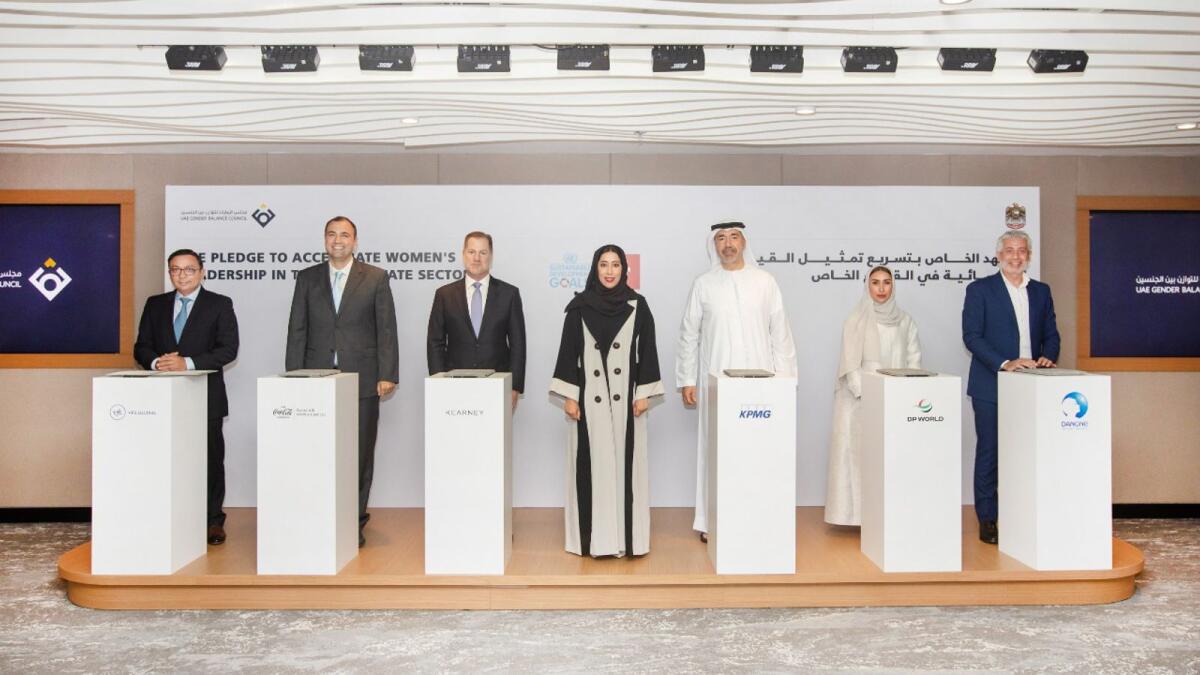 Mona Al Marri, Hanan Ahli  along with  government officials and representatives from DP World, Kearney, KPMG, Coca-Cola, Danone and VFS Global, during the pledge signing ceremony in Dubai. — Supplied photo