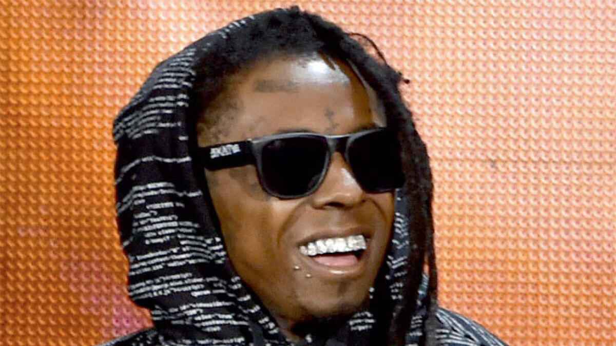 ‘Prisoner’ Lil Wayne blames label for new album delay