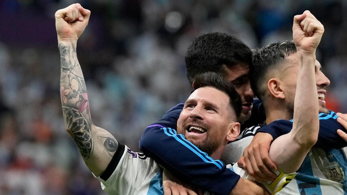 Lionel Messi celebrates at the end of the World Cup quarter-final soccer match between the Netherlands and Argentina. — AP