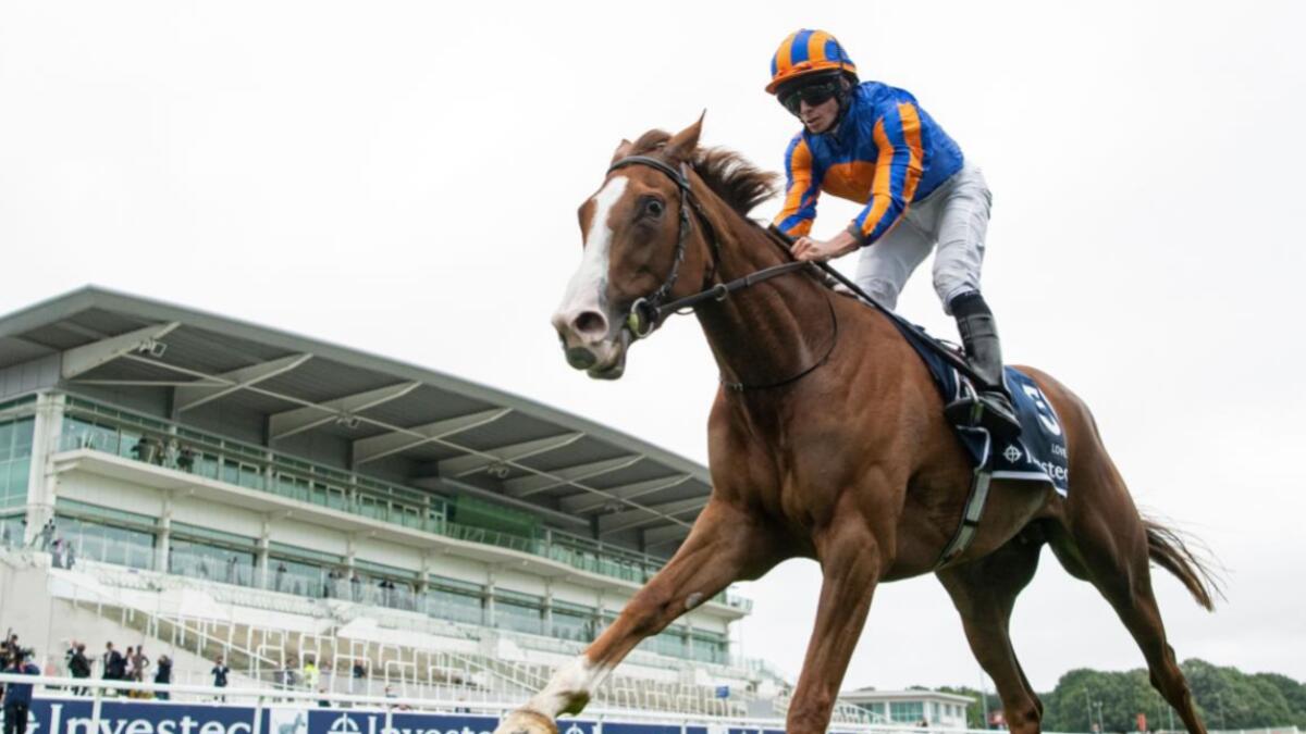 Jockey Ryan Moore rides Love to victory in the Oaks Stakes at the Epsom Derby Festival, south of London. The Epsom Derby and Oaks are being run on the same day for the first time in history on Saturday after being postponed from June due to the coronavirus pandemic.  Photo: AFP