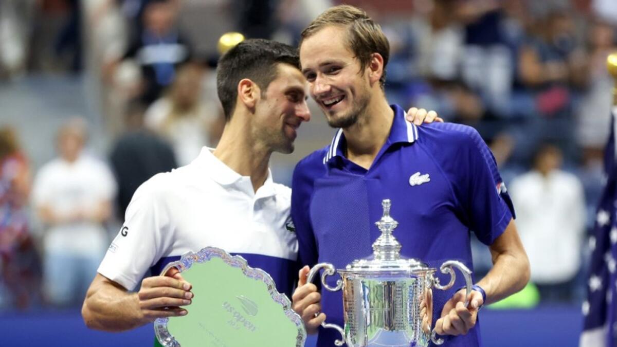 Novak Djokovic shares a light moment with Medvedev during the presentation ceremony. (US Open Twitter)