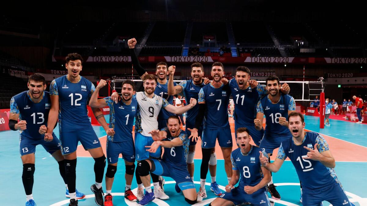 Team members of Argentina pose for a photograph after their volleyball match against the US. — Reuters