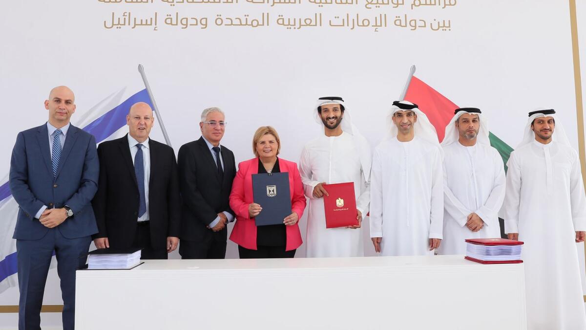 Abdulla bin Touq Al Marri, Orna Barbivay, and Dr Thani bin Ahmed Al Zeyoudi,,  along with other senior officials during signing ceremony of  Comprehensive Economic Partnership Agreement between UAE-Israel in Dubai  on Tuesday. — Wam