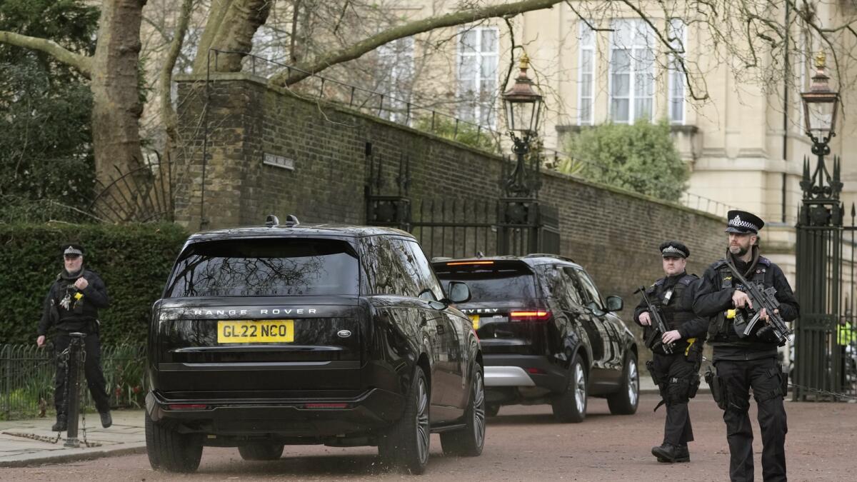 A convoy of cars believed to be carrying Prince Harry arrive at Clarence House following the announcement of King Charles III's cancer diagnosis.