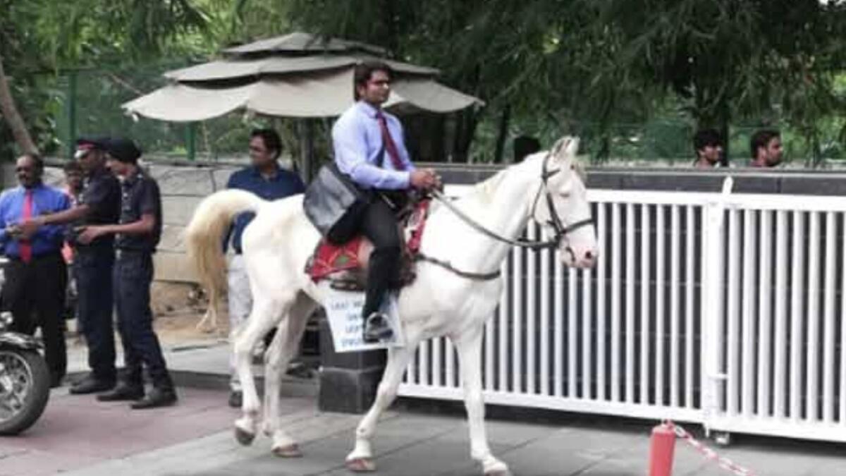 Video: Man rides horse to work on last day 
