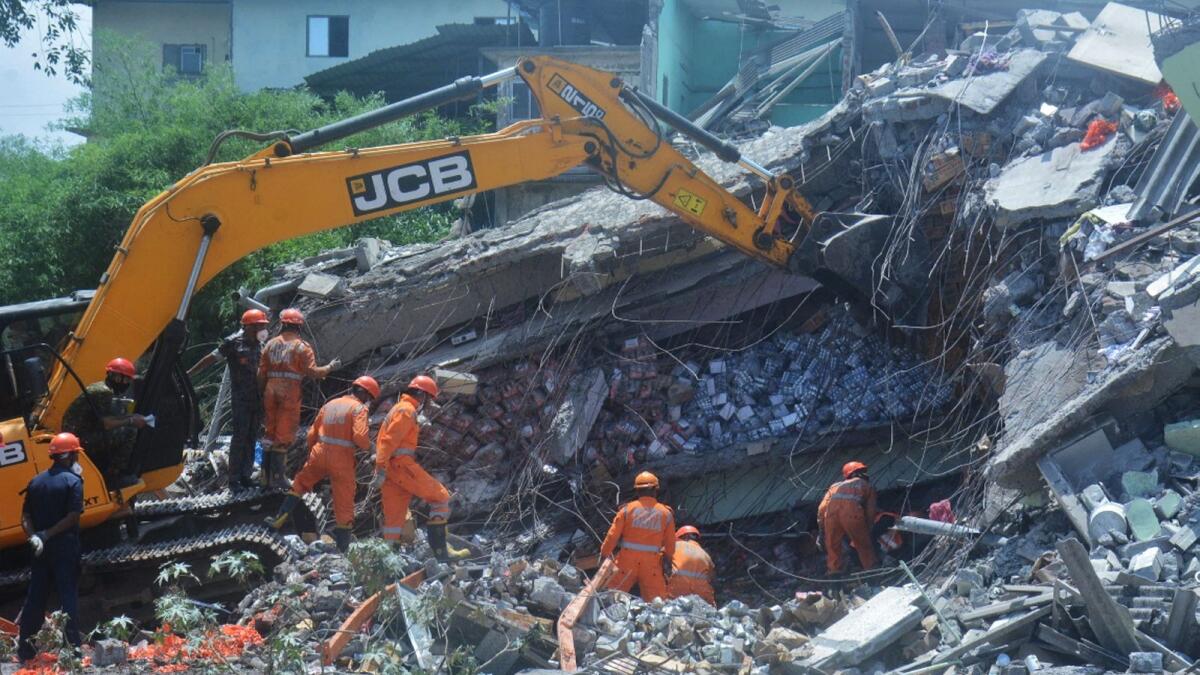 Rescue operations under way after a two-storey building collapsed at Bhiwandi, in Thane district. — PTI