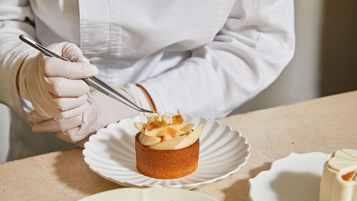 At Lysée, her pastry shop in Manhattan, Mrs. Leecarefully constructs tarts with pears maceratedin the Korean citron yuja and the Koreancinnamon tea sujeonggwa. — Rachel Vanni/The New York Times