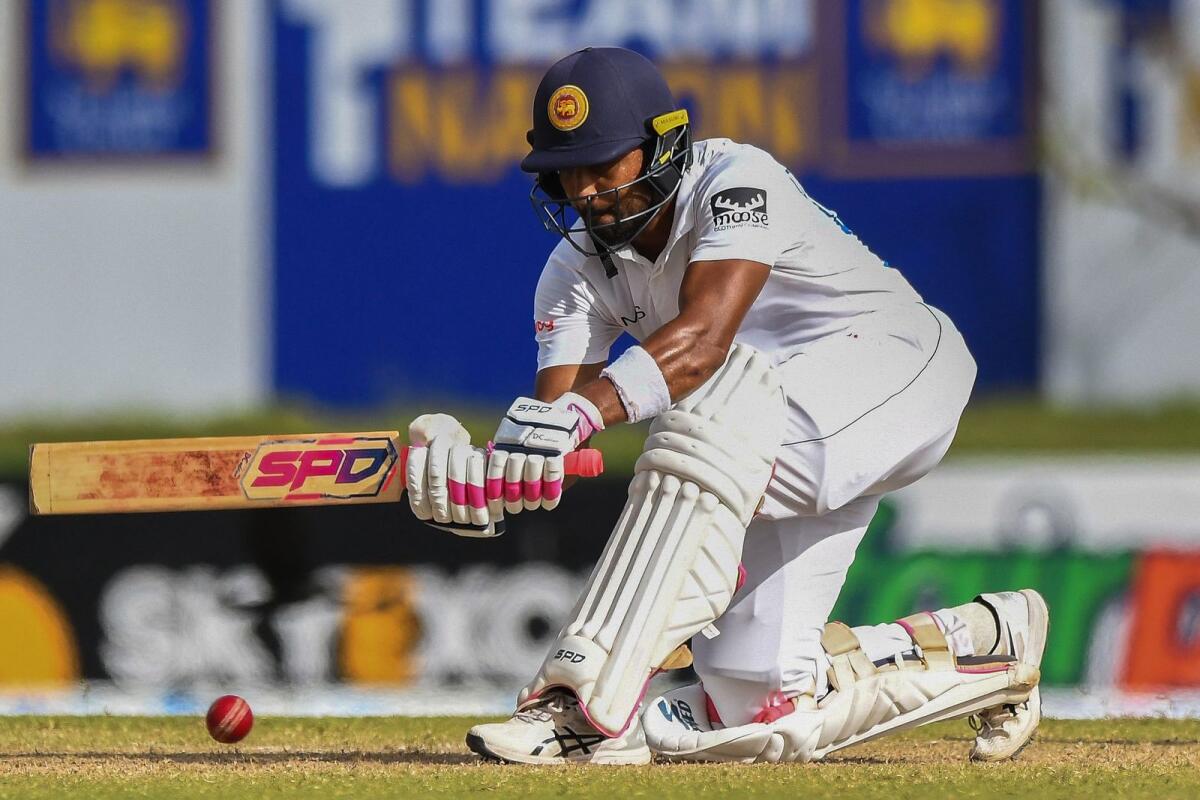Sri Lanka's Dinesh Chandimal plays a shot during the third day of the first Test against Pakistan at the Galle International Cricket Stadium. (AFP)
