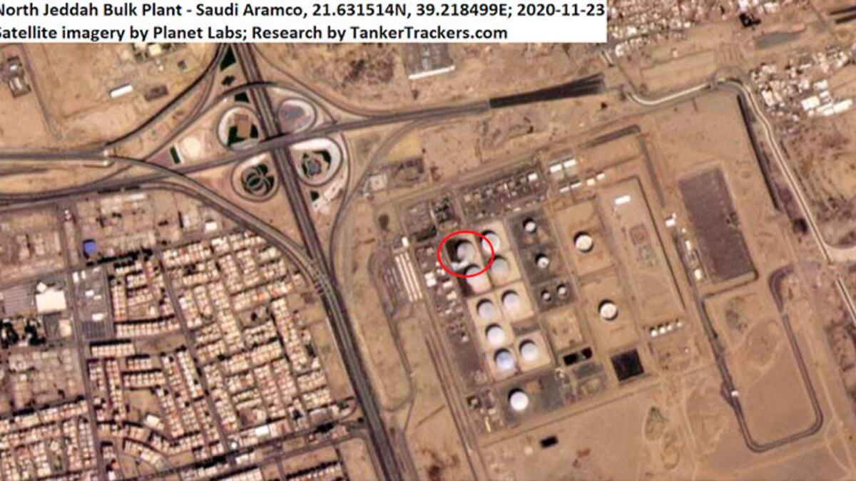 This Monday, Nov. 23, 2020 satellite image from Planet Labs Inc. annotated by TankerTrackers.com, shows a damaged tank and fire-suppressing foam on the ground at a Saudi Arabian Oil Co. facility in Jeddah, Saudi Arabia.