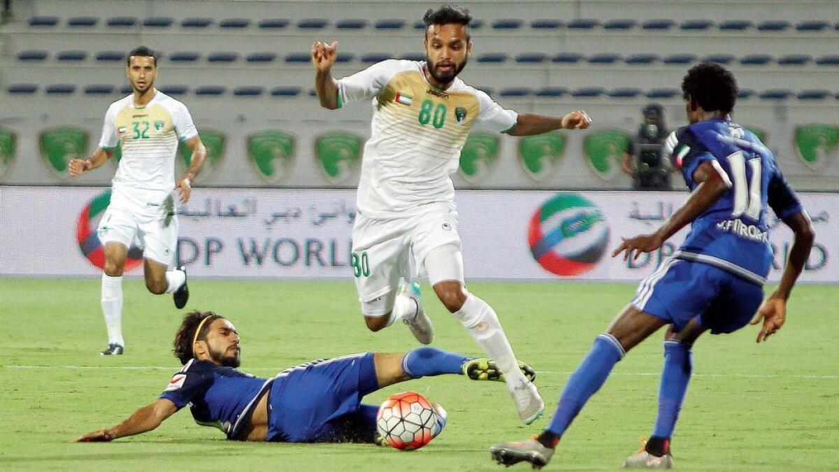 Khaled Khamis of Emirates Club in action against Tariq Ahmed of Al Nasr during the Arabian Gulf League match at Maktoum Stadium in Dubai on Friday night. 
