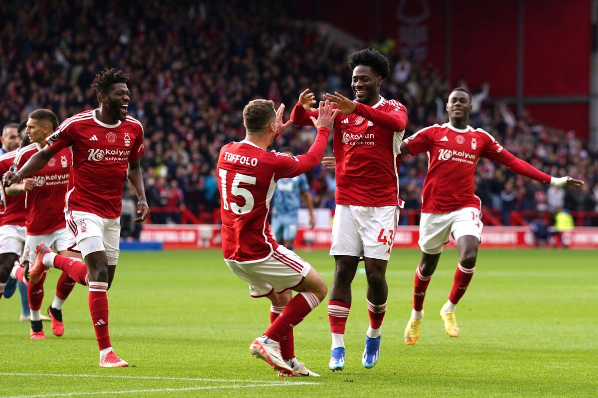 Nottingham Forest's Ola Aina (second right) celebrates scoring their side's first goal of the game. — AP