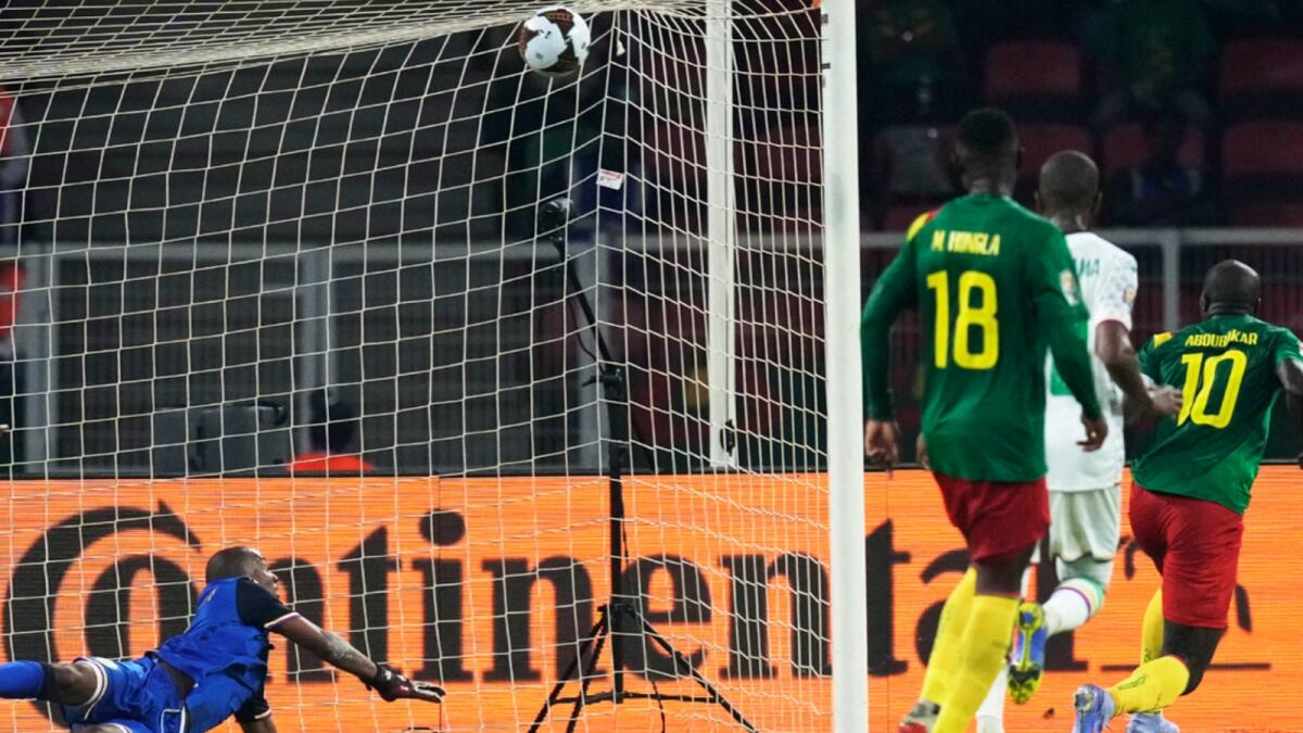 Comoros' goalkeeper Chaker Alhadhur fails to stop a goal shot from Cameroon's Vincent Aboubakar. — AP