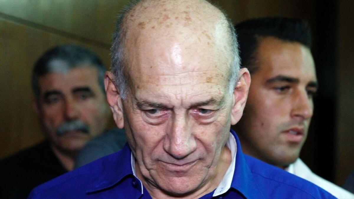 Former Israeli PM Olmert insists on innocence as jail term begins