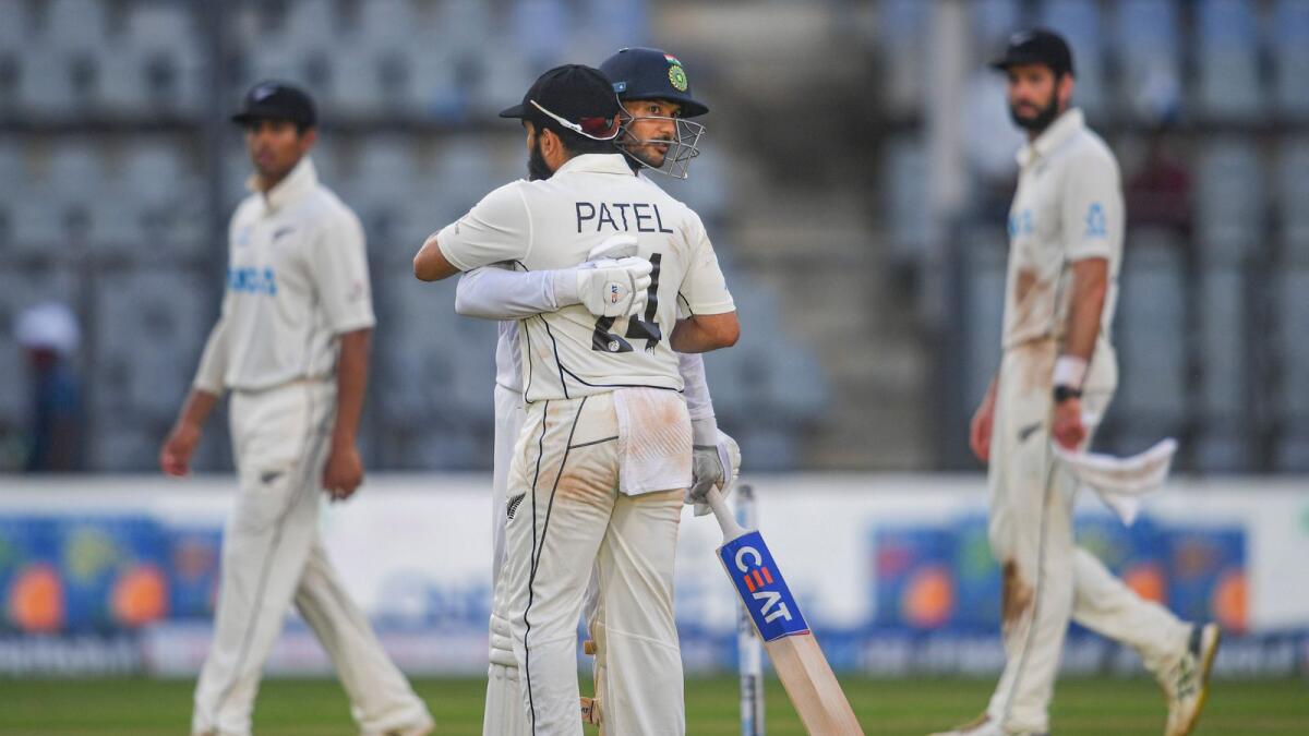 Indian batsman Mayank Agarwal hugs New Zealand's Ajaz Patel to congratulate him for taking 10 wickets in an innings. (PTI)