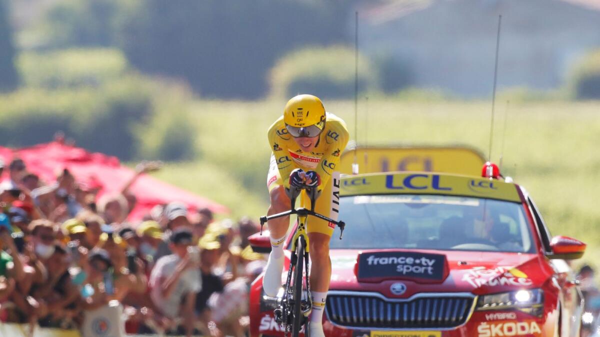 UAE Team Emirates rider Tadej Pogacar wearing the yellow jersey in action during stage 20.— Reuters