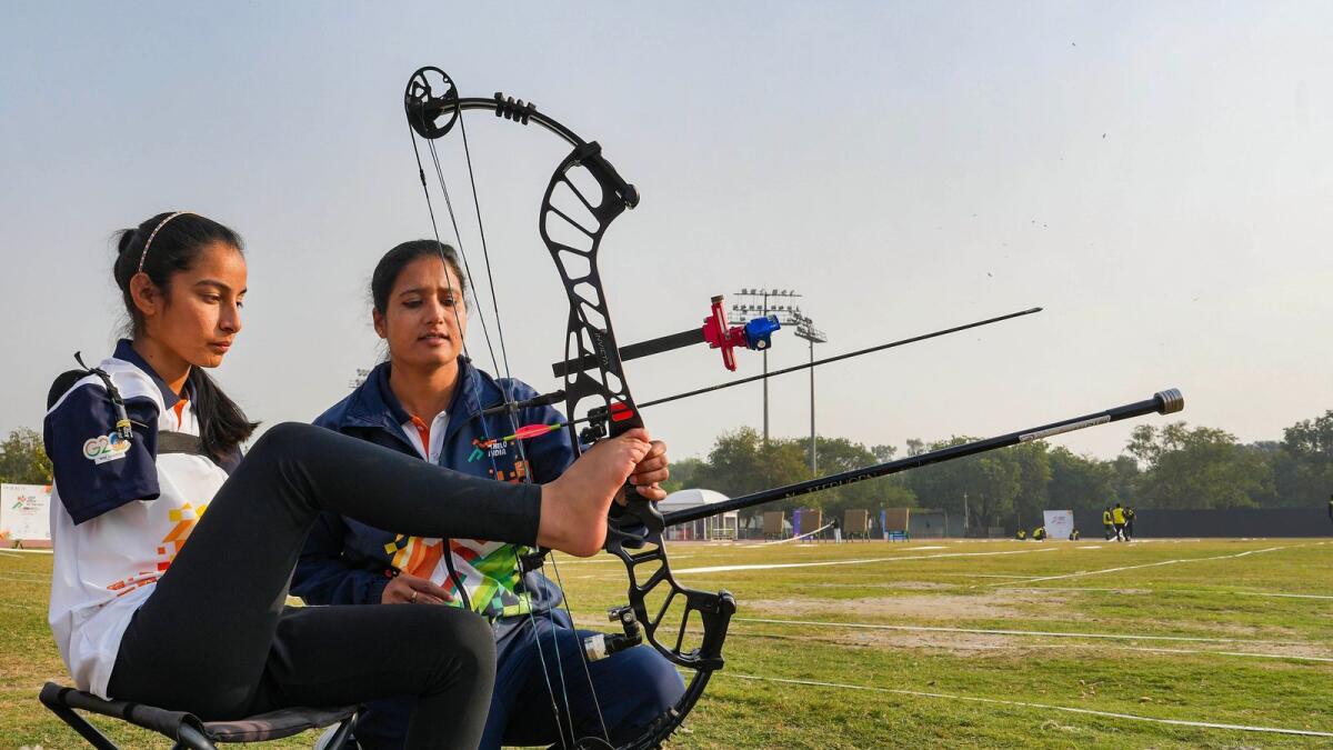 Armless archer Sheetal Devi with her coach Abhilasha Choudhary at the Khelo India Para Games, in New Delhi,. - PTI
