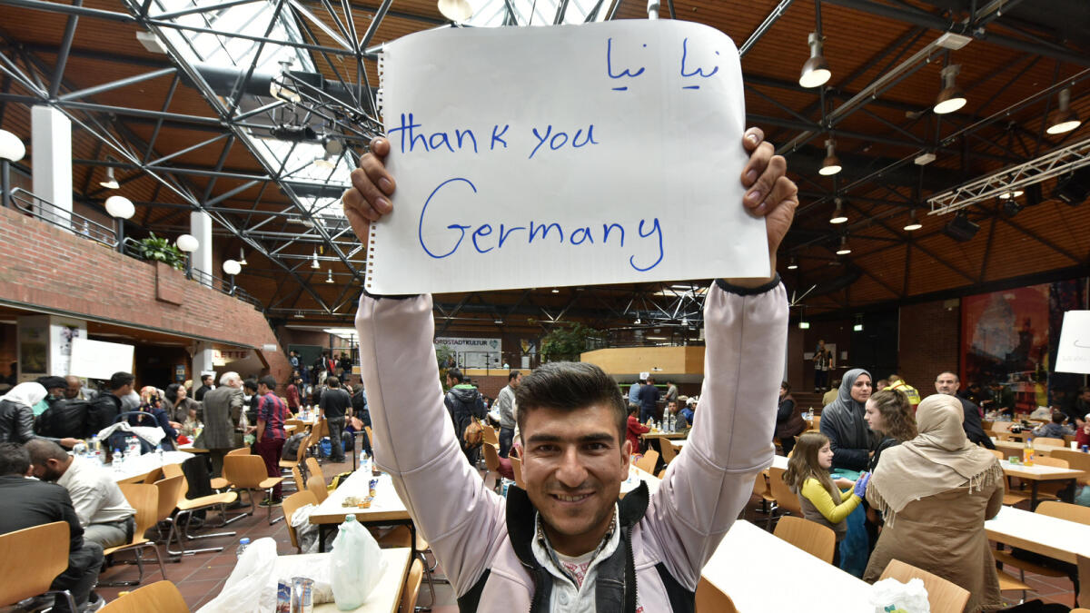 Thousands of refugees, migrants arrive in Germany