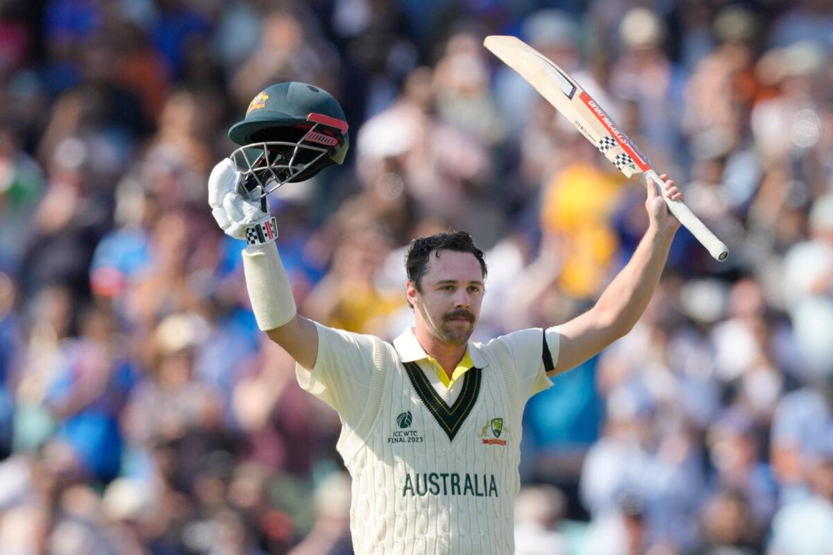 Australia's Travis Head celebrates his century. — AP