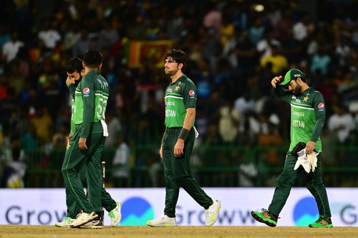 Pakistan's captain Babar Azam (L) with teammates walks back to the pavilion after Sri Lanka won by 2 wickets during the Asia Cup 2023 Super Four one-day international (ODI) cricket match against Sri Lanka. Photo: AFP
