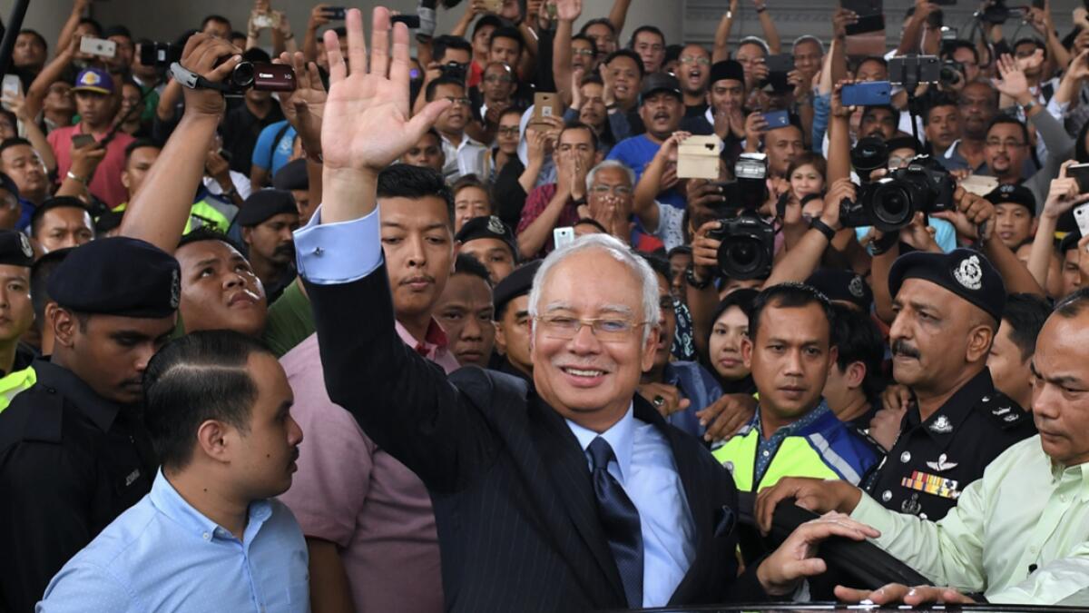 In this file photo, Malaysia's former prime minister Najib Razak waves after a court appearance in Kuala Lumpur. A Malaysian court on July 28, 2020 will hand down its verdict in Najib Razak's first corruption trial, nearly 16 months after it began probing the former prime minister's role in the multi-billion-dollar 1MDB scandal. - Photo: AFP