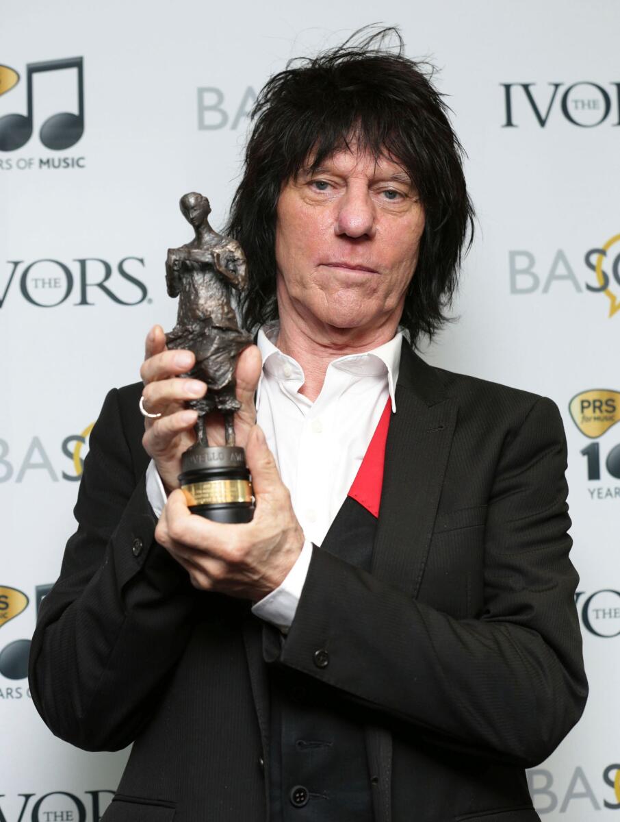 Jeff Beck holds his Outstanding Contribution to British Music award, at the 59th annual Ivor Novello Awards, at Grosvenor House, in London, on May 22, 2014