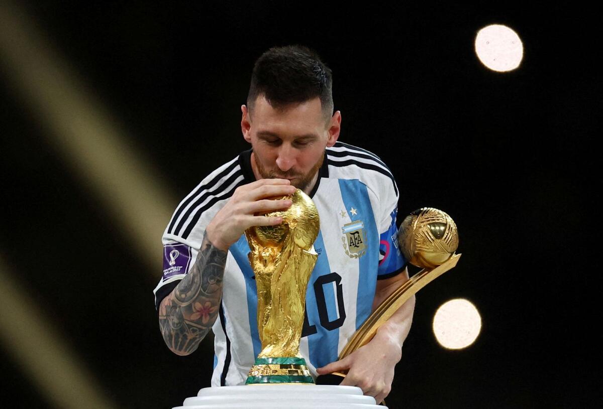 Argentina's Lionel Messi kisses the World Cup trophy. — Reuters file