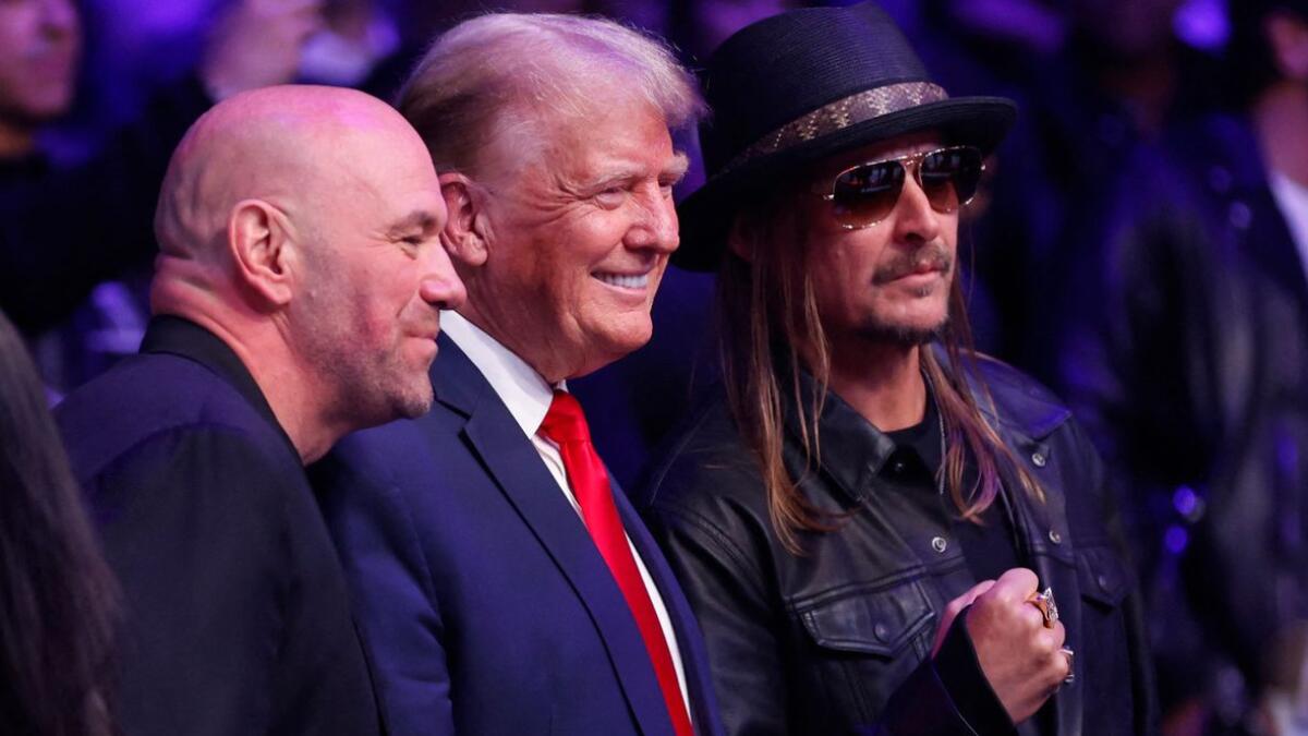 Former U.S. President Donald Trump, UFC president Dana White, and Kid Rock pose during UFC 295 at Madison Square Garden. - AFP