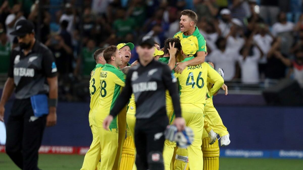 Australian players celebrate after winning the T20 World Cup final against New Zealand in Dubai. (AP)