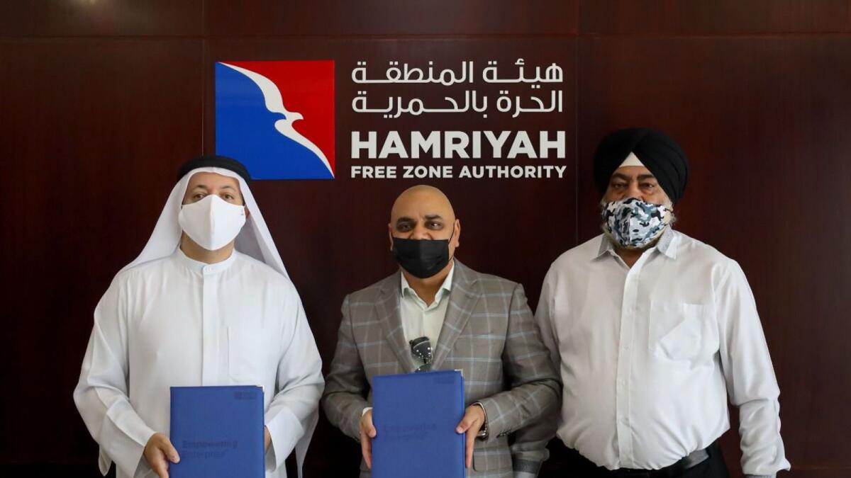 Saud Salim Al Mazrouei, director of the Hamriyah Free Zone Authority, and Neeraj K Sharma, CEO of Trend Industries, signed the partnership agreement in the presence of a number of senior officials from both entities. — Supplied photo