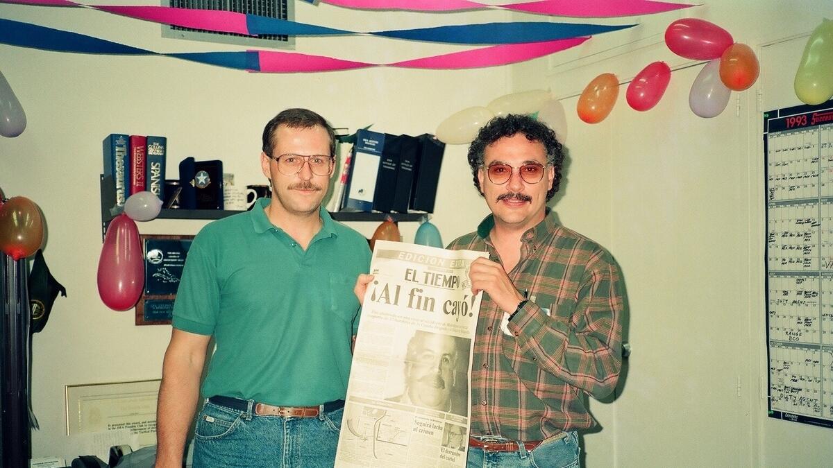VICTORY!: Steve and Javier hold up a newspaper declaring Pablo’s death