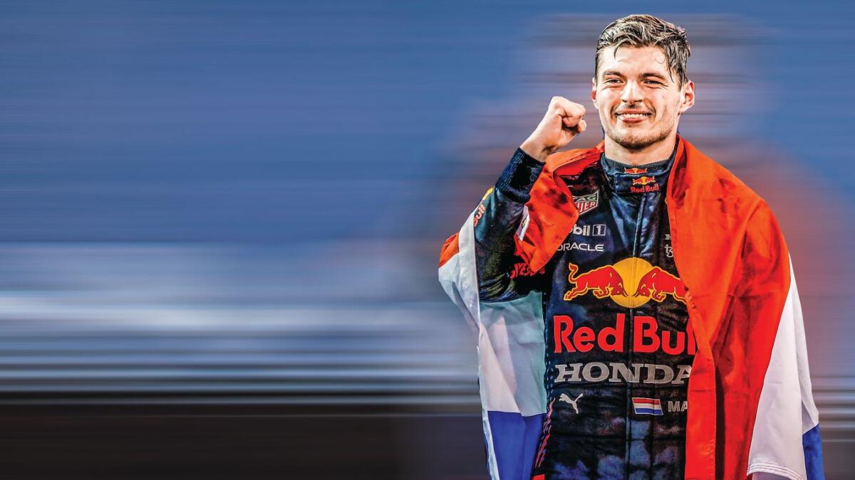 Formula One world champion Red Bull's Max Verstappen celebrates on the podium on Sunday. — AFP